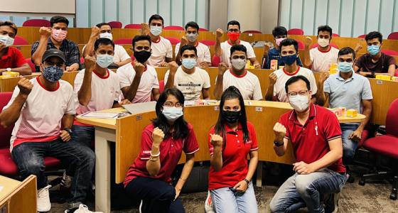 Migrant students in a 24asia training session